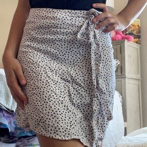 Wrap up brandy Melville skirt, that you tie on the side. With tiny blue flowers.